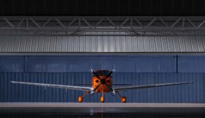 Front-facing view of a Cirrus SR Series G7 aircraft positioned inside a hangar