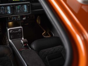 Interior view of the Cirrus SR Series G7 cockpit showing seats, center console, and avionics